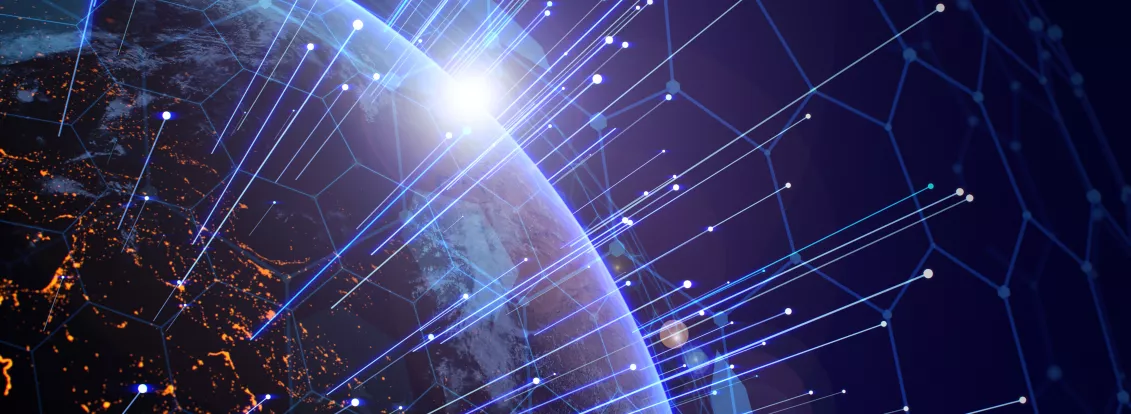 A view of Earth from space with a digital network overlay. Bright lines and nodes represent global connectivity, while city lights are visible on the planet's surface. The sun is rising on the horizon, casting a glow over the scene.