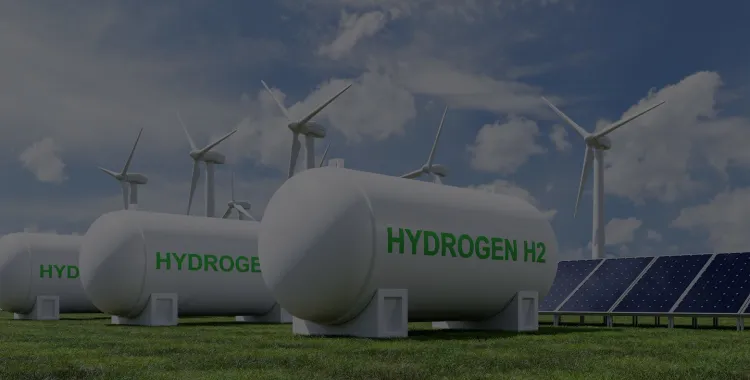 Image of a renewable energy site featuring large hydrogen storage tanks labeled 'HYDROGEN H2', wind turbines, and solar panels under a partly cloudy sky.