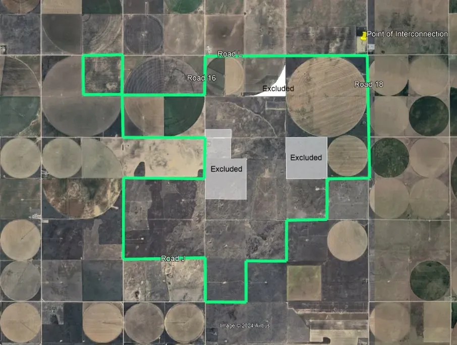 Aerial map showing a grid of circular and square fields. A green outline marks a specific area, with gray boxes labeled 'Excluded' within it. Roads labeled 'Road 16', 'Road 18', and 'Road J' intersect the area. A yellow marker labeled 'Point of Interconnection' is at the top right corner.