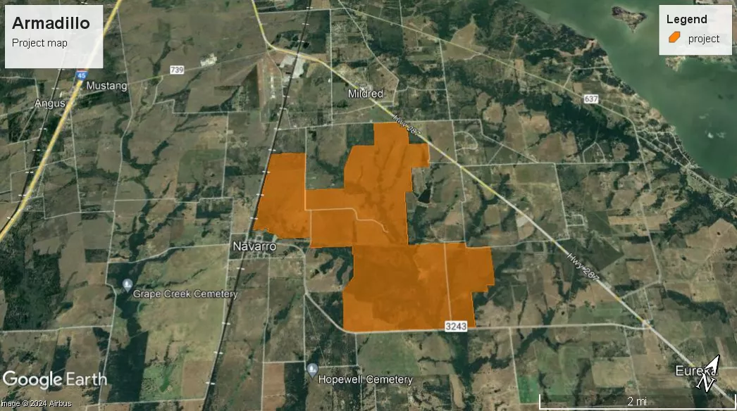 A satellite map titled 'Armadillo Project Map' shows an orange shaded area representing the project site. The map includes labeled locations such as Navarro, Mildred, and Eureka, as well as highways and cemeteries like Grape Creek and Hopewell. A legend indicates that the orange shading denotes the project area.