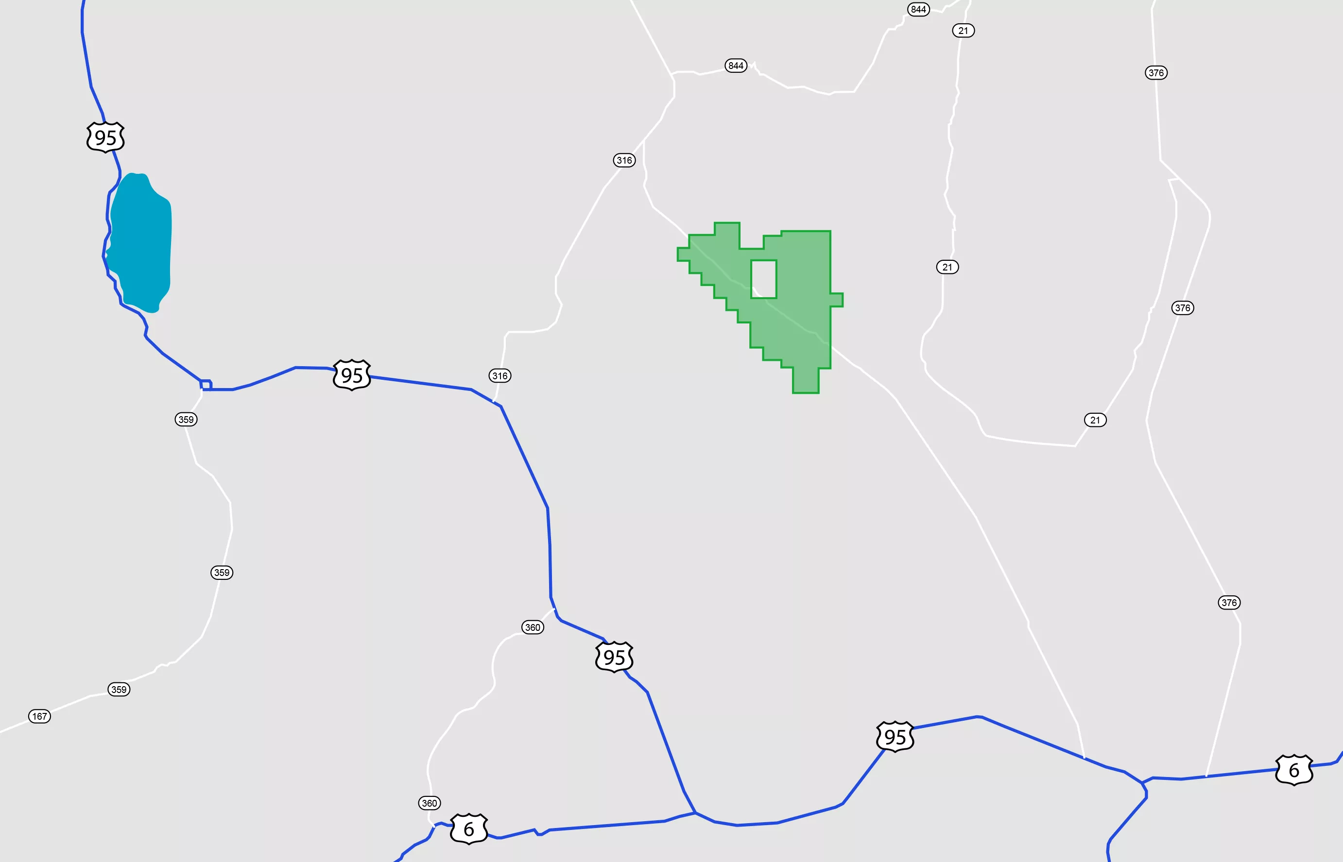Map showing highways and roads with a green highlighted area and a blue lake. Highway 95 runs vertically on the left side, intersecting with Highway 6 at the bottom. The green area is to the right of Highway 95, and the blue lake is to the left.