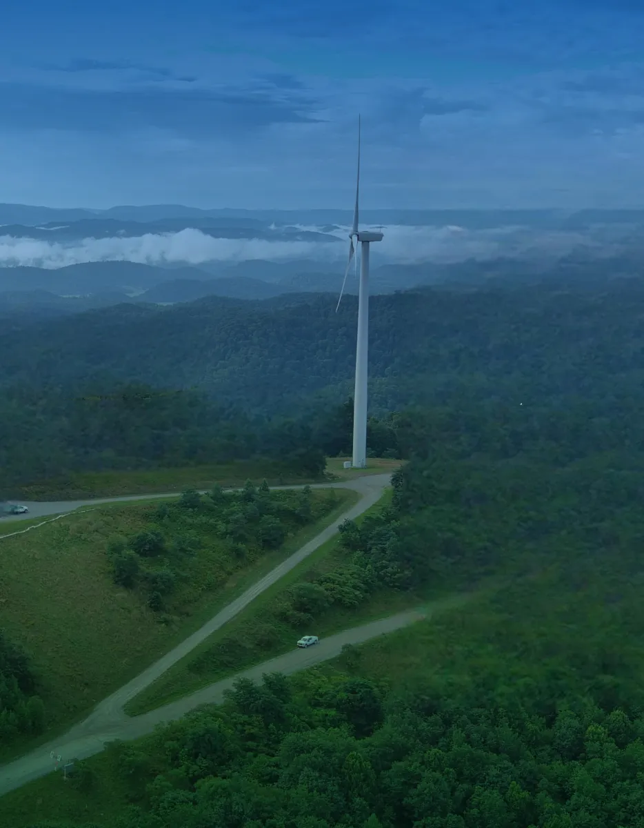 /sites/global/files/styles/parallax_hero_first_image/public/2025-02/aerial-wind-turbines-hillside.jpg.webp?itok=HKsOWTI_