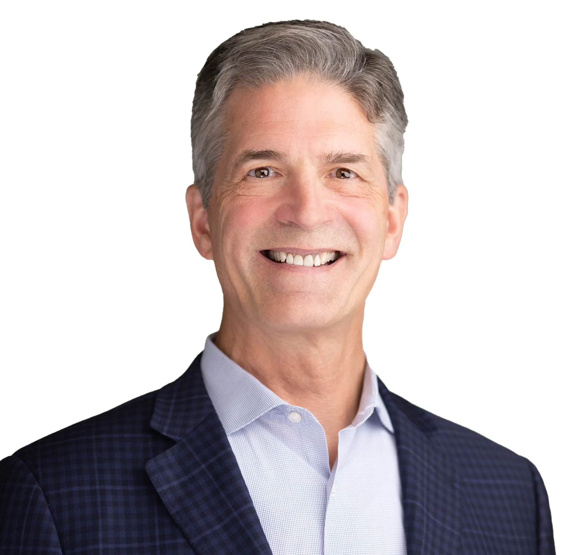 Smiling man in a dark checkered suit jacket and light shirt against a white background.