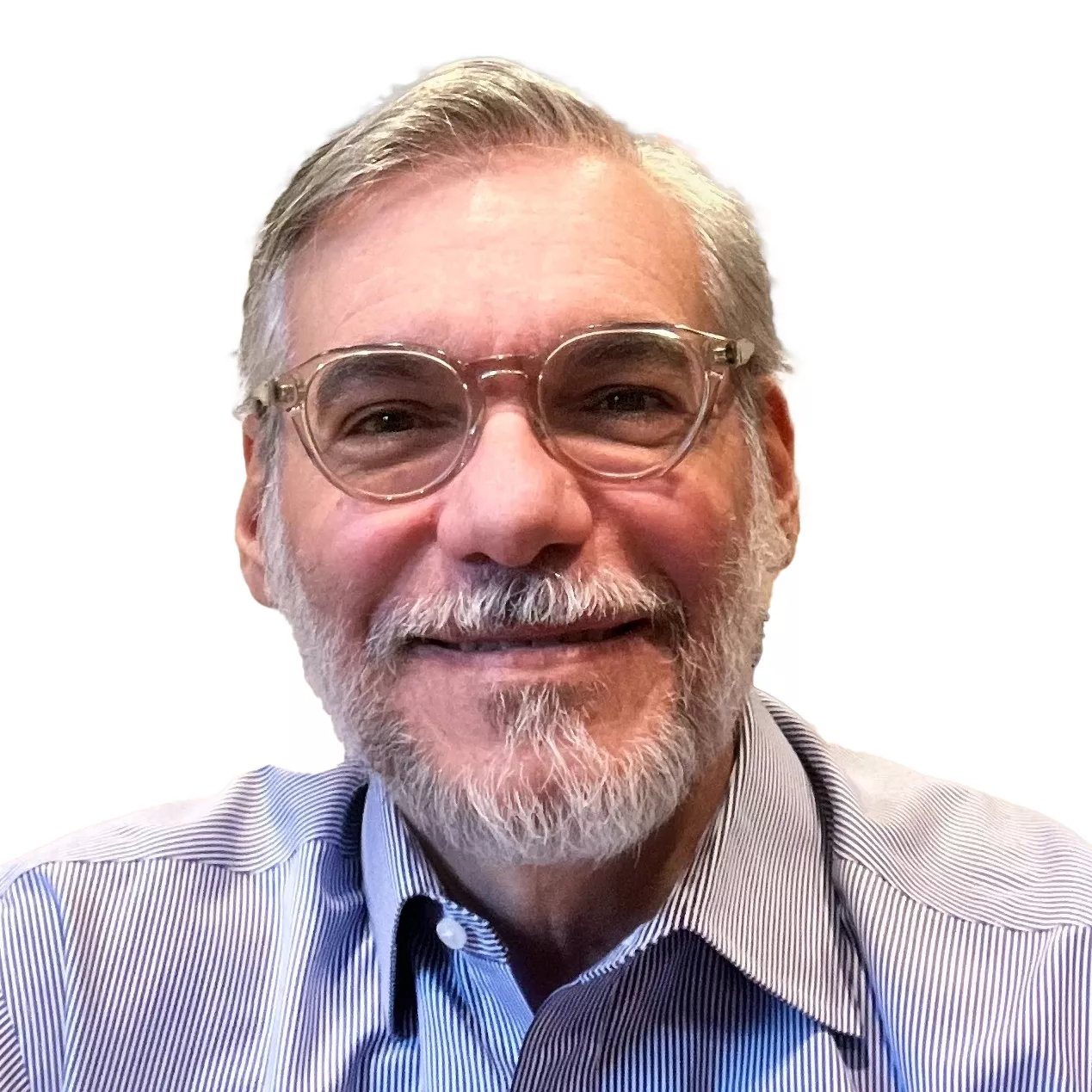 A man with gray hair and a beard is smiling. He is wearing glasses and a striped shirt. The background is plain white.