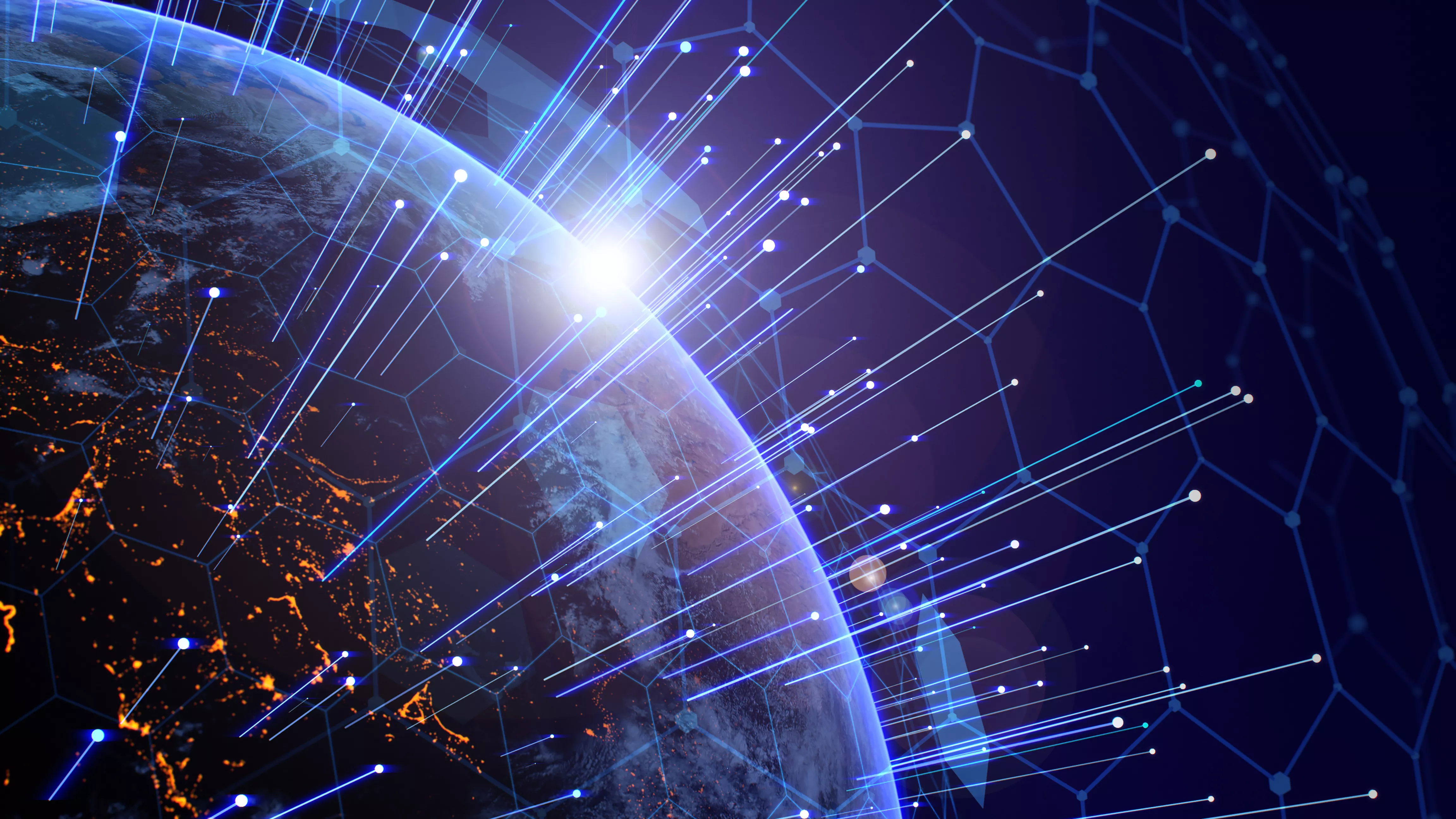 A view of Earth from space with a digital network overlay. Bright lines and nodes represent global connectivity, while city lights are visible on the planet's surface. The sun is rising on the horizon, casting a glow over the scene.
