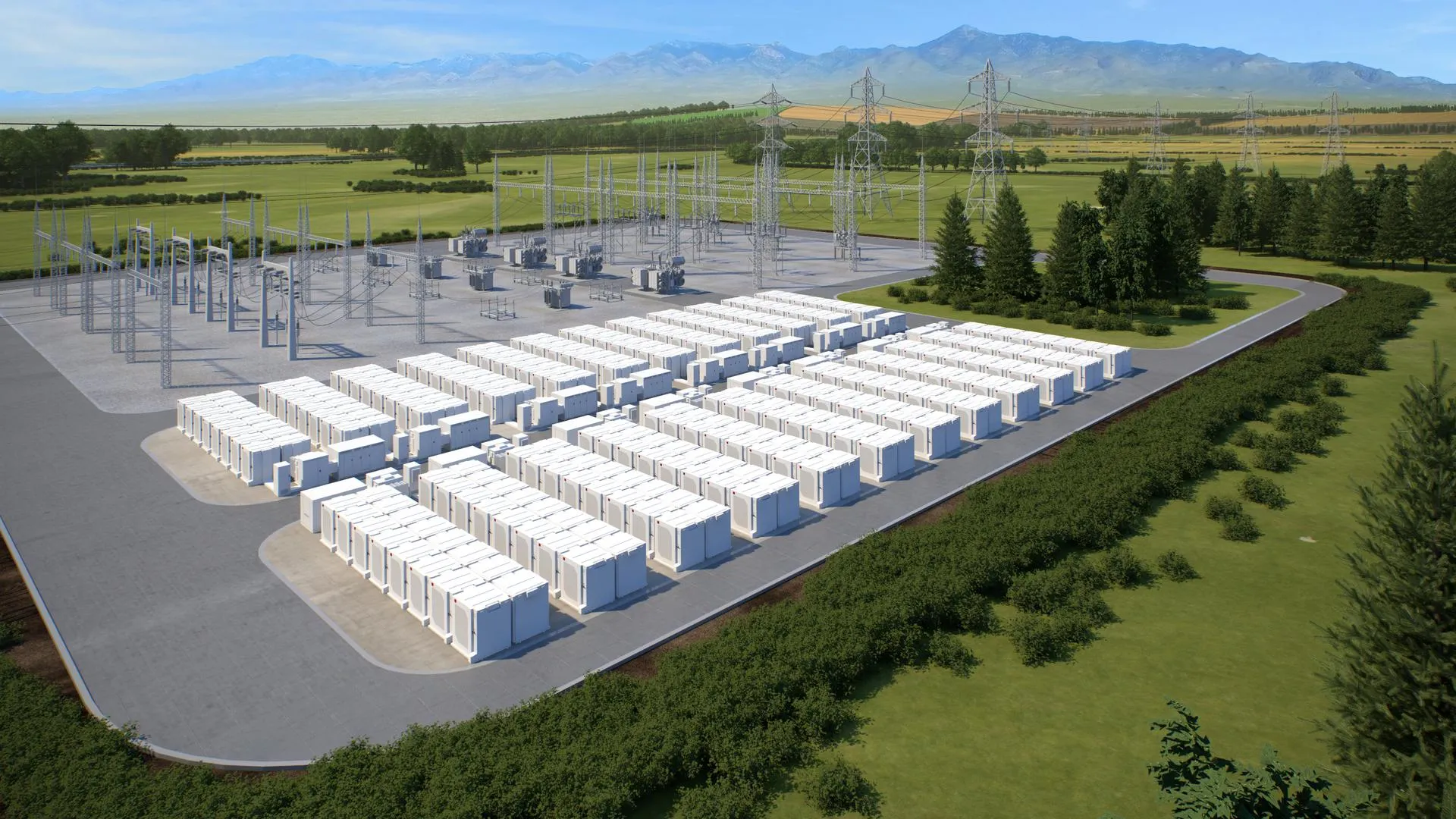 A large outdoor energy storage facility with numerous white battery units arranged in rows. Adjacent to the battery units are electrical substations with metal structures and power lines. The facility is surrounded by green fields and trees, with mountains visible in the background under a clear blue sky.
